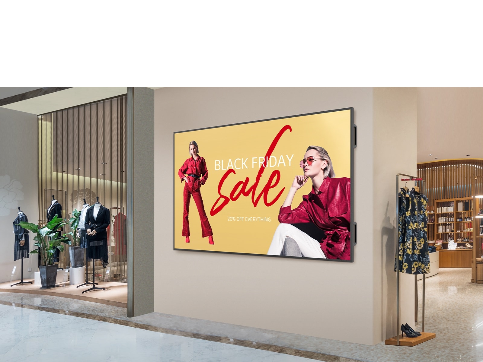 A large display is installed on a shopping mall’s interior wall, and the display’s screen is showing advertisements clearly and vibrantly.