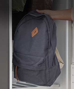 Image of backpack being placed in LG Styler