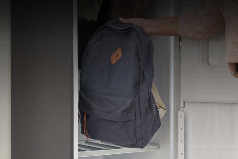 Image of backpack being placed in LG Styler