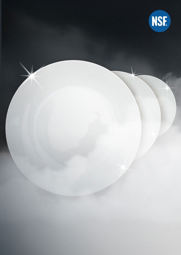 shiny clean plates surrounded by steam on a black background