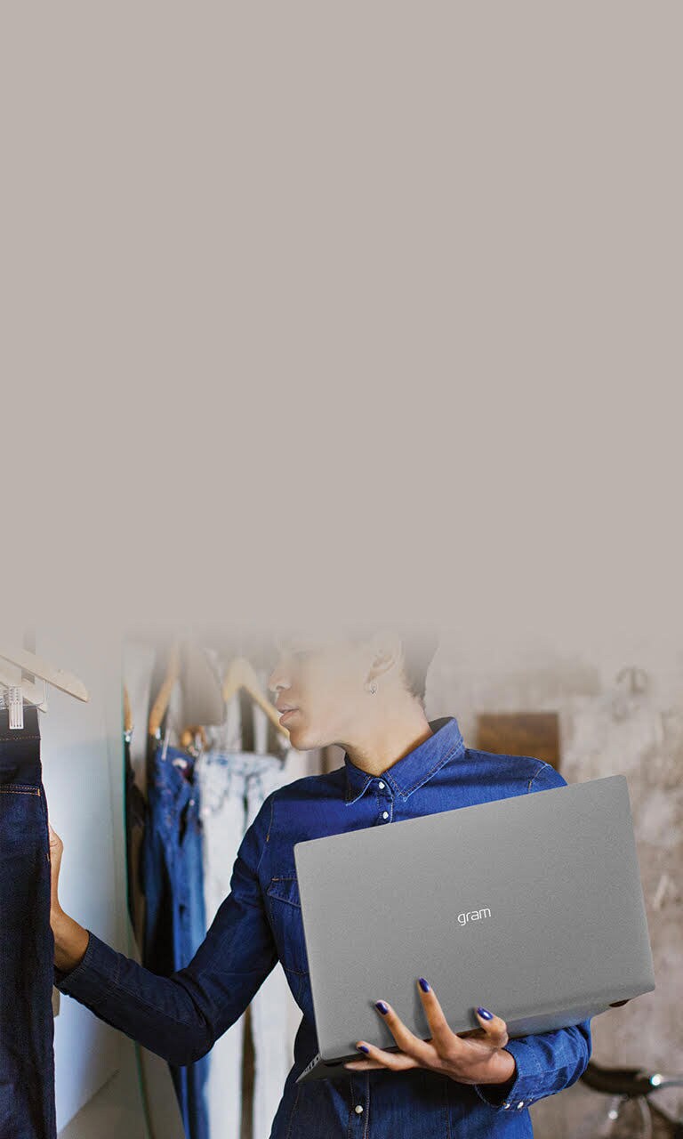 woman holding a personal laptop