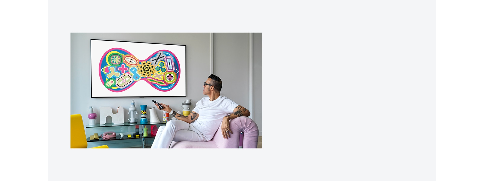 A man sitting on a chair enjoying gallery TV