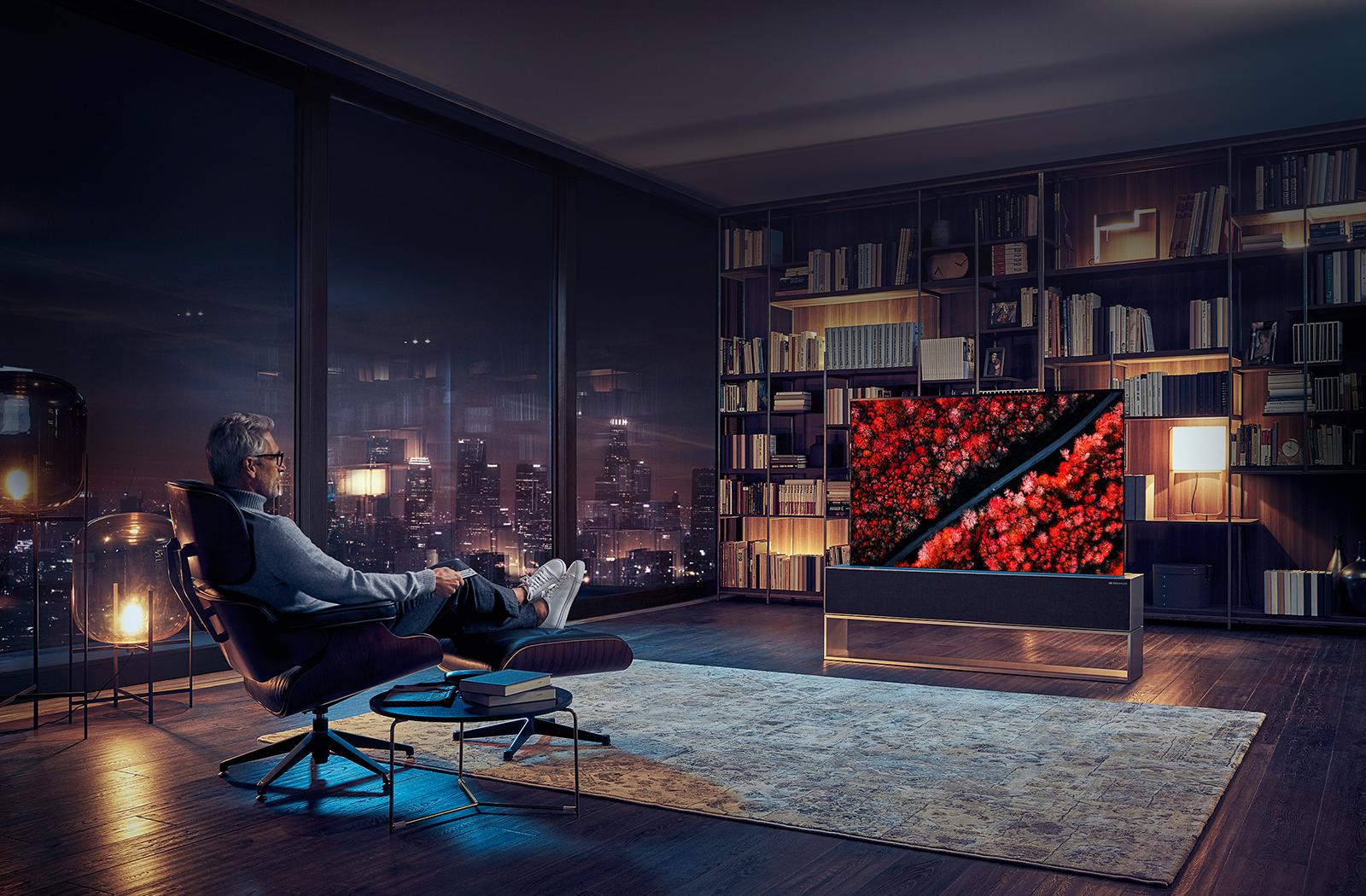 Man watching TV in a luxury living room.