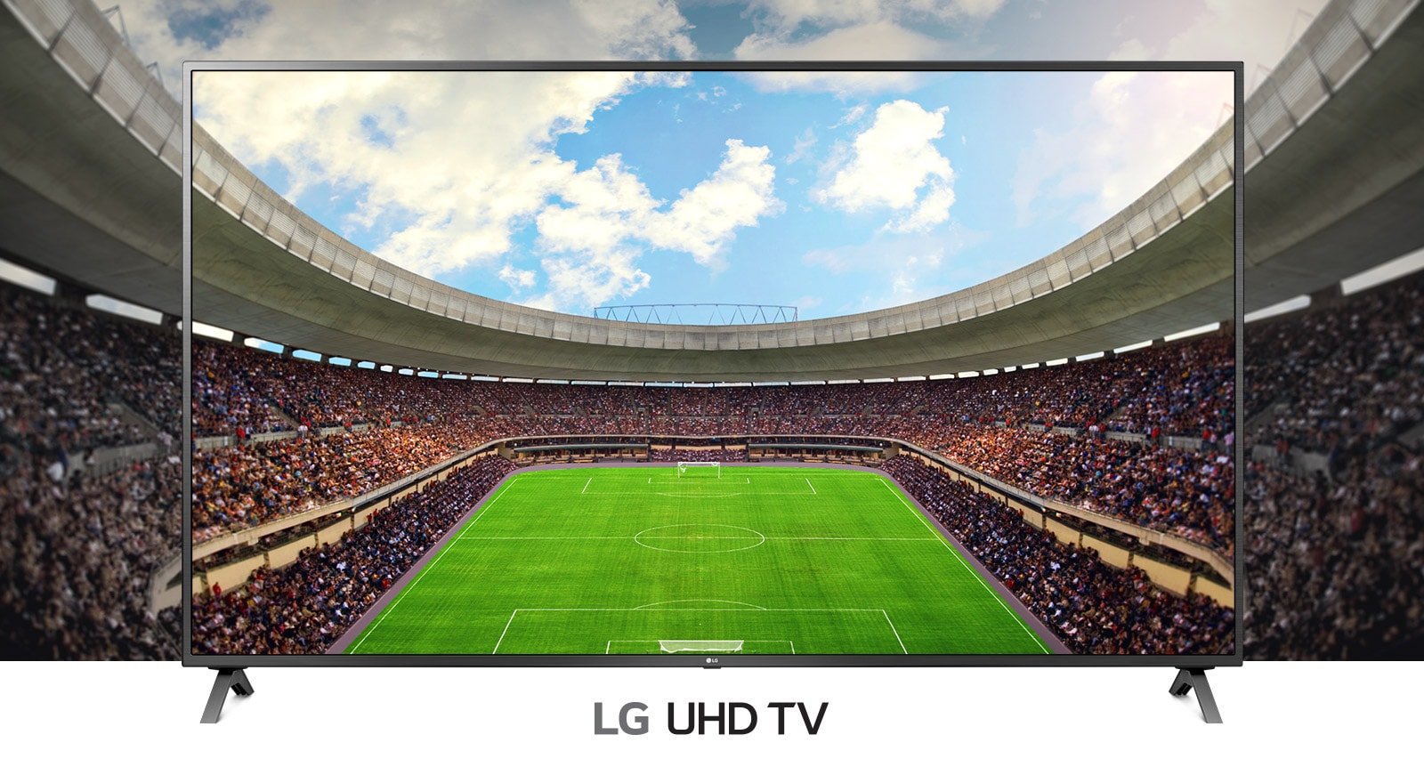 A panoramic view of the soccer stadium filled with spectators shown inside a TV frame.