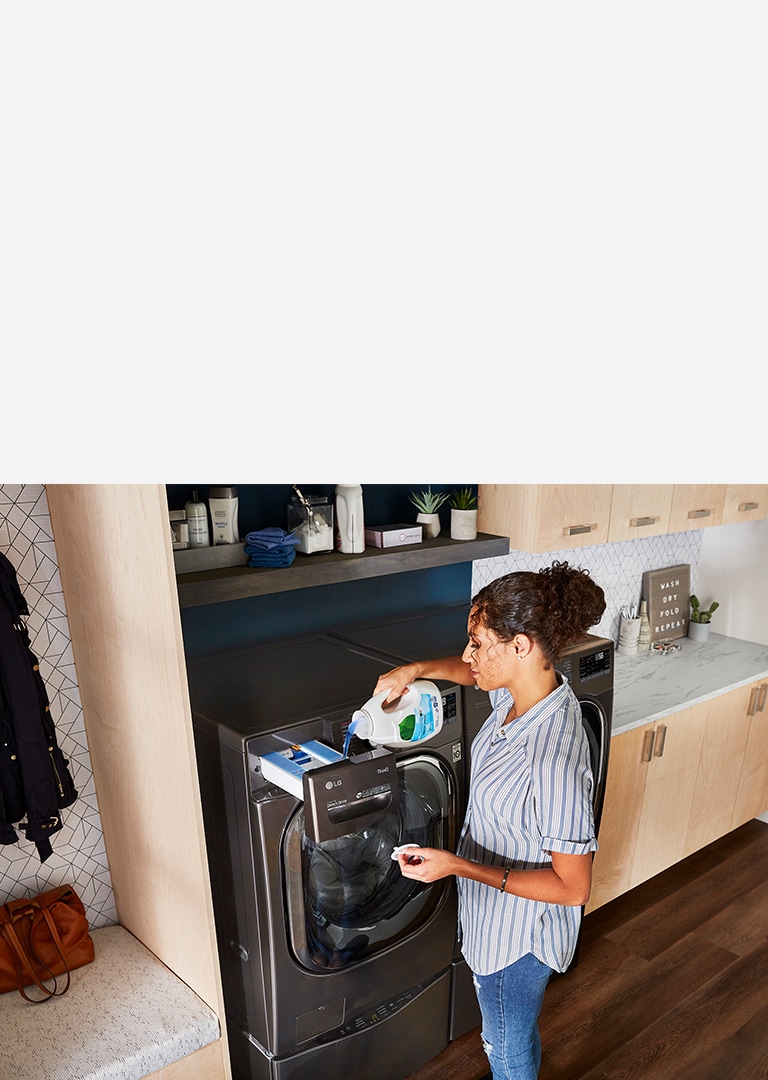 A woman pouring detergent in the LG Washer
