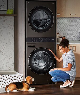 A woman is sitting in front of a product