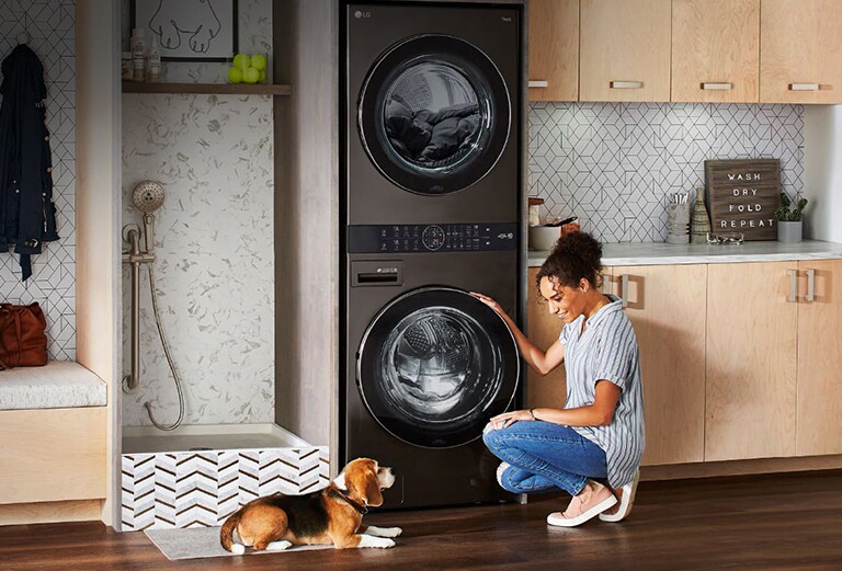 A woman is sitting in front of a product