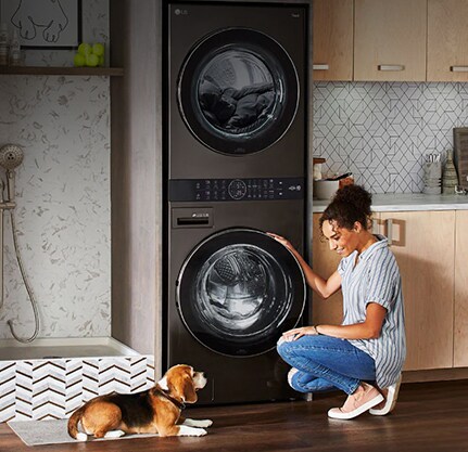 A woman is sitting in front of a product