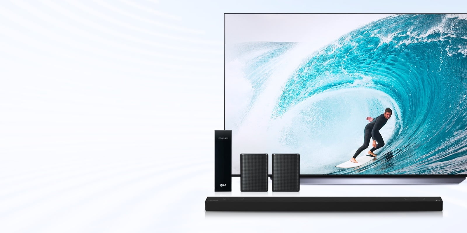 TV, sound bar, and rear wireless speakers and a man surfing the ocean infill