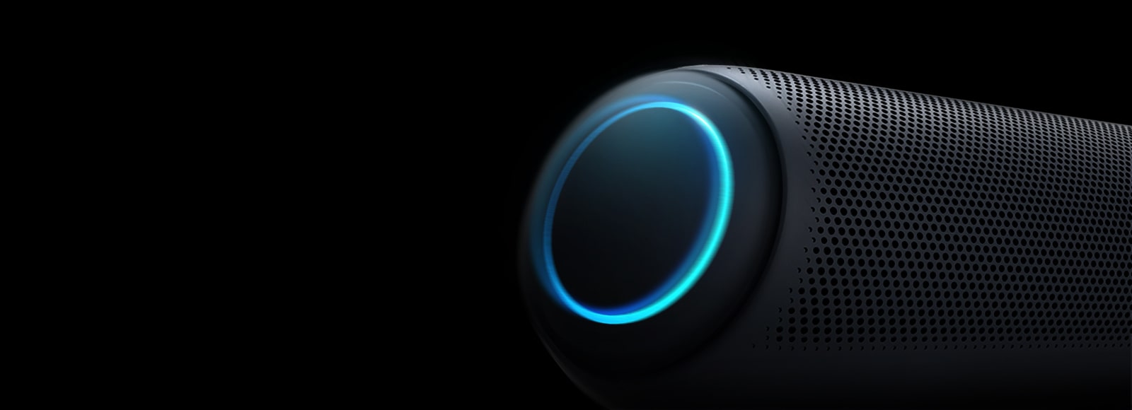 On a black background, There is a close-up of LG XBOOM Go's left woofer with sky-blue lighting.