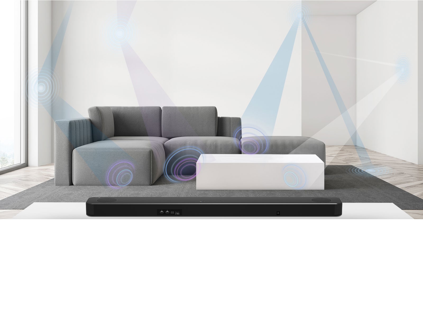 Back of LG Soundbar in living room with gray sofa in the center. Graphics of the wavelength measuring the space are shown.