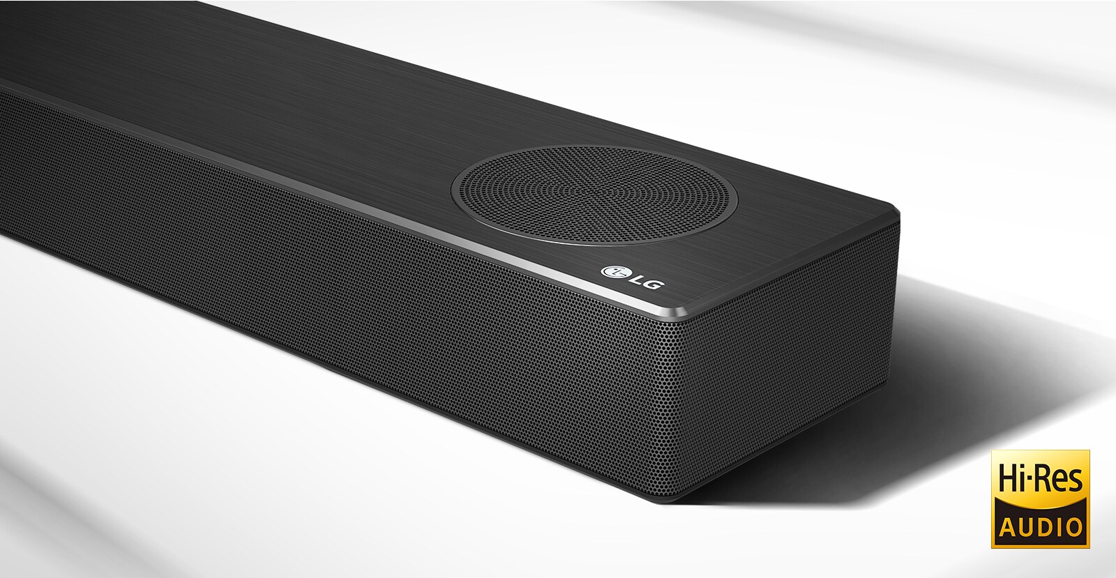 Close-up right side of LG Soundbar with LG logo shown on the bottom right corner. Hi-Res logo is shown below the product.