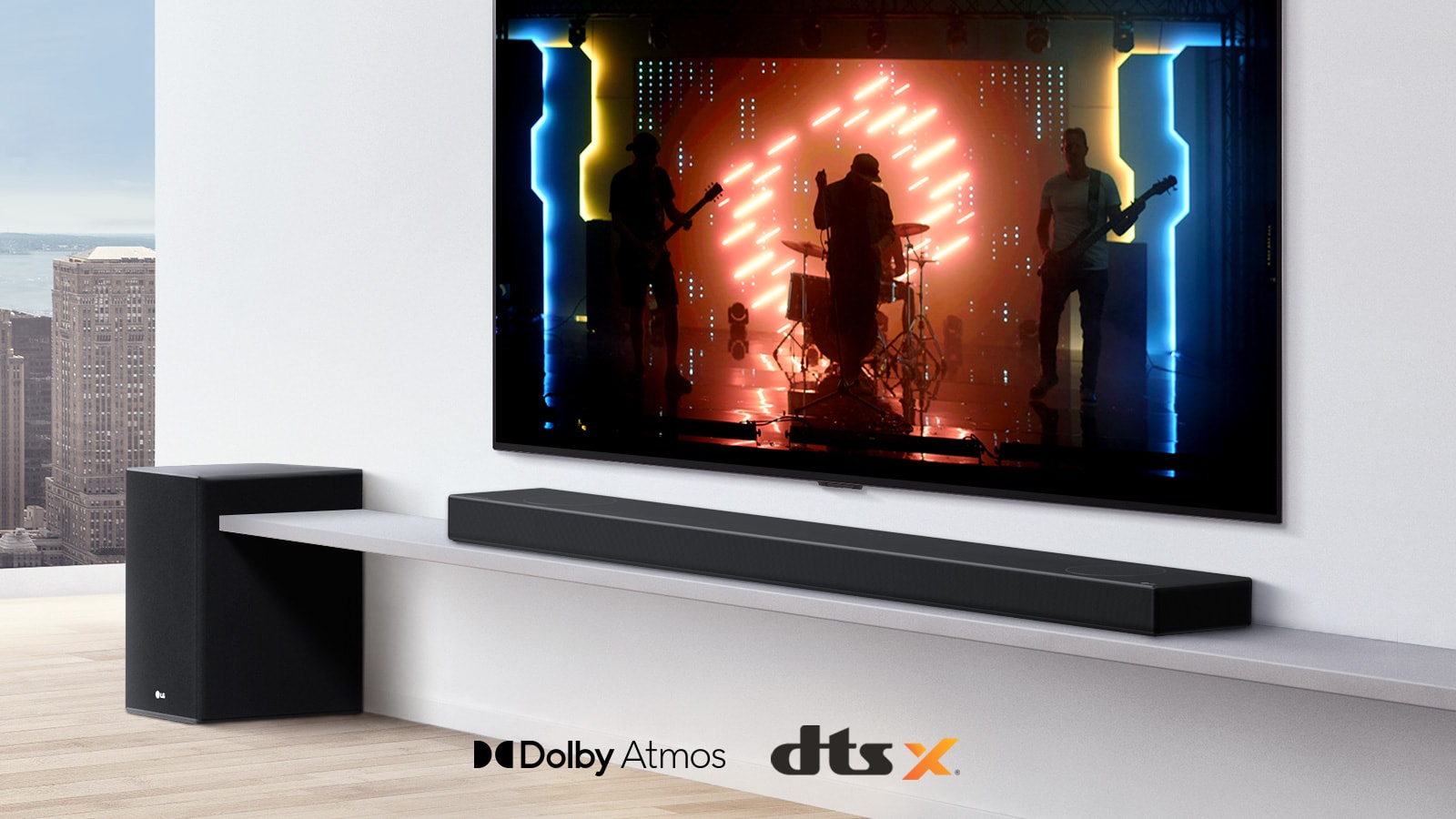 TV is on the wall.  A poster of a TV show is on TV screen. LG Soundbar is right below TV on a white shelf with a sub-woofer right next. Dolby Atmos and DTS:X logo shown on middle bottom of image.