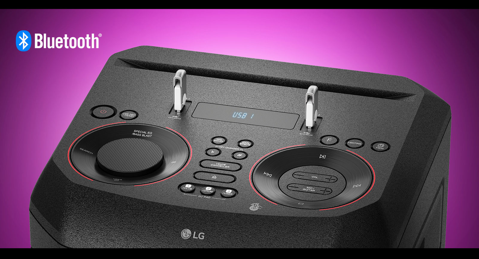 A closeup view of controls on top of LG XBOOM, with two USBs plugged in. A Bluetooth logo is shown in the upper left corner.