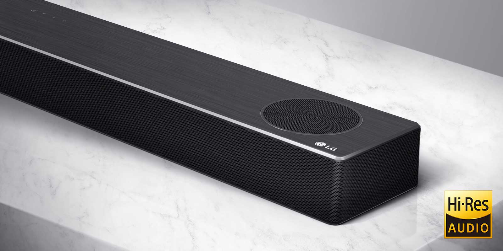 Close-up of LG Soundbar right side with LG logo on the bottom right corner of a product.