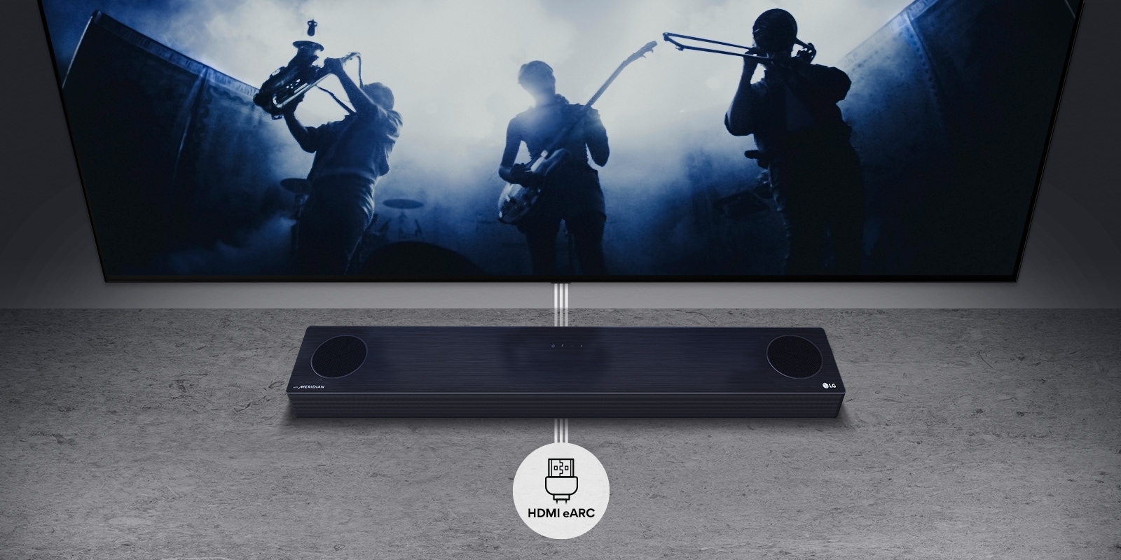 TV is on the wall. TV shows a group of band in black silhouette. LG Soundbar is right below TV on a gray shelf. There is a HDMI eARC icon below the soundbar.