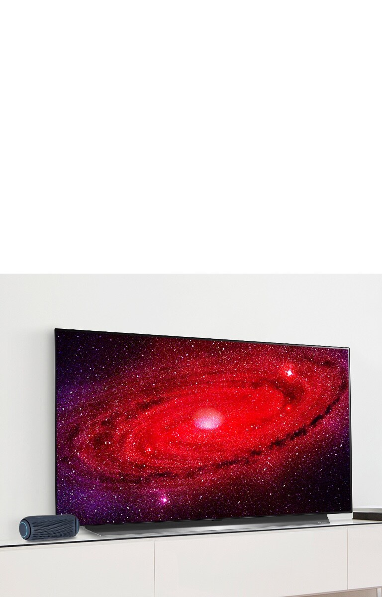 LG TV with PL5 portable speaker in a living room