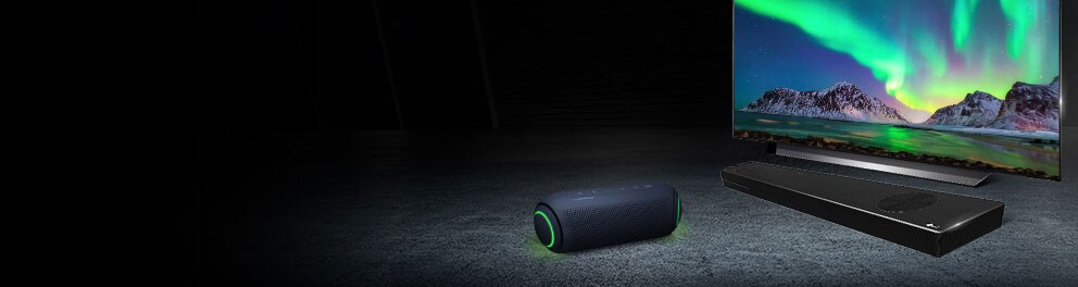 XBOOM speaker next to LG OLED TV and sound bar