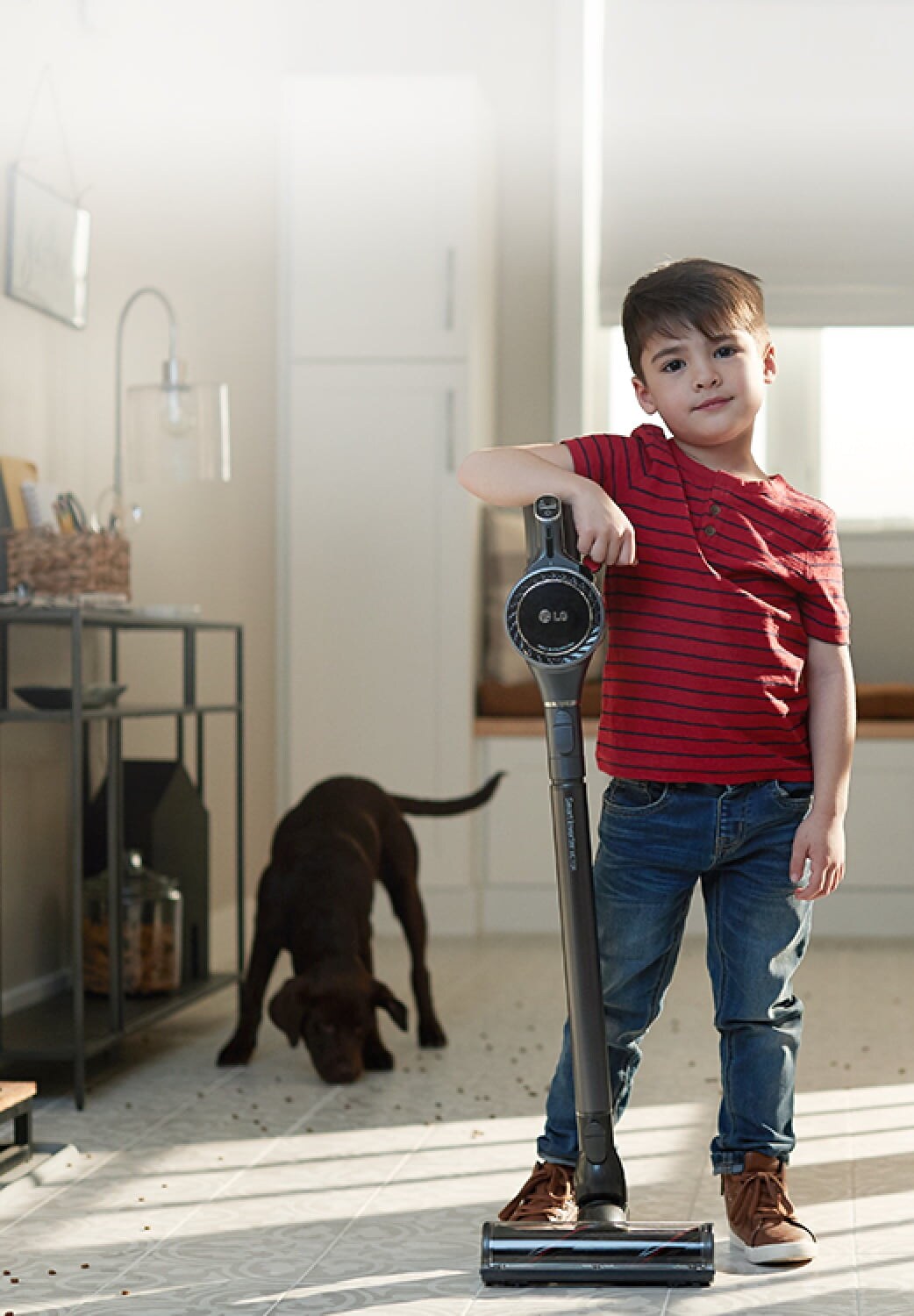 a boy with LG vacuum