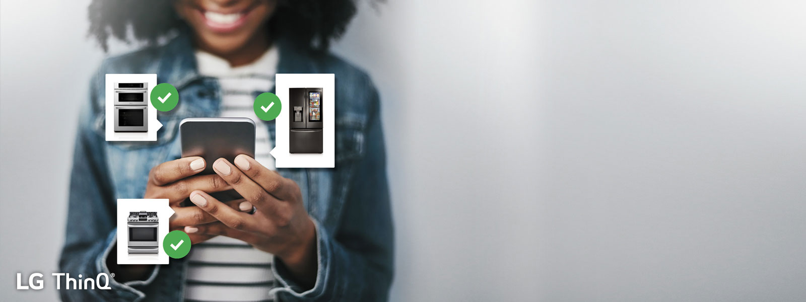 woman holding a phone with lg appliance icons floating around the phone