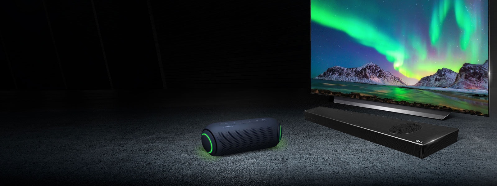 XBOOM speaker next to LG OLED TV and sound bar