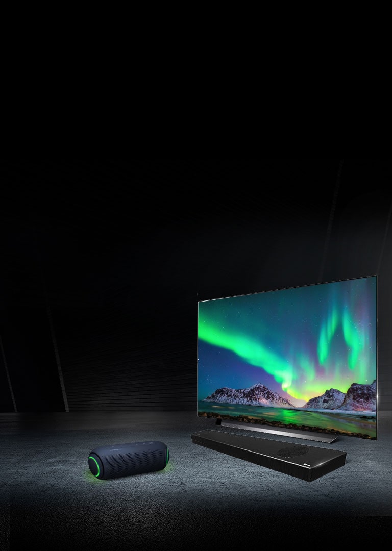XBOOM speaker next to LG OLED TV and sound bar