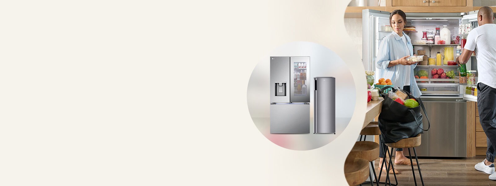 a couple packing food in front of a refrigerator 