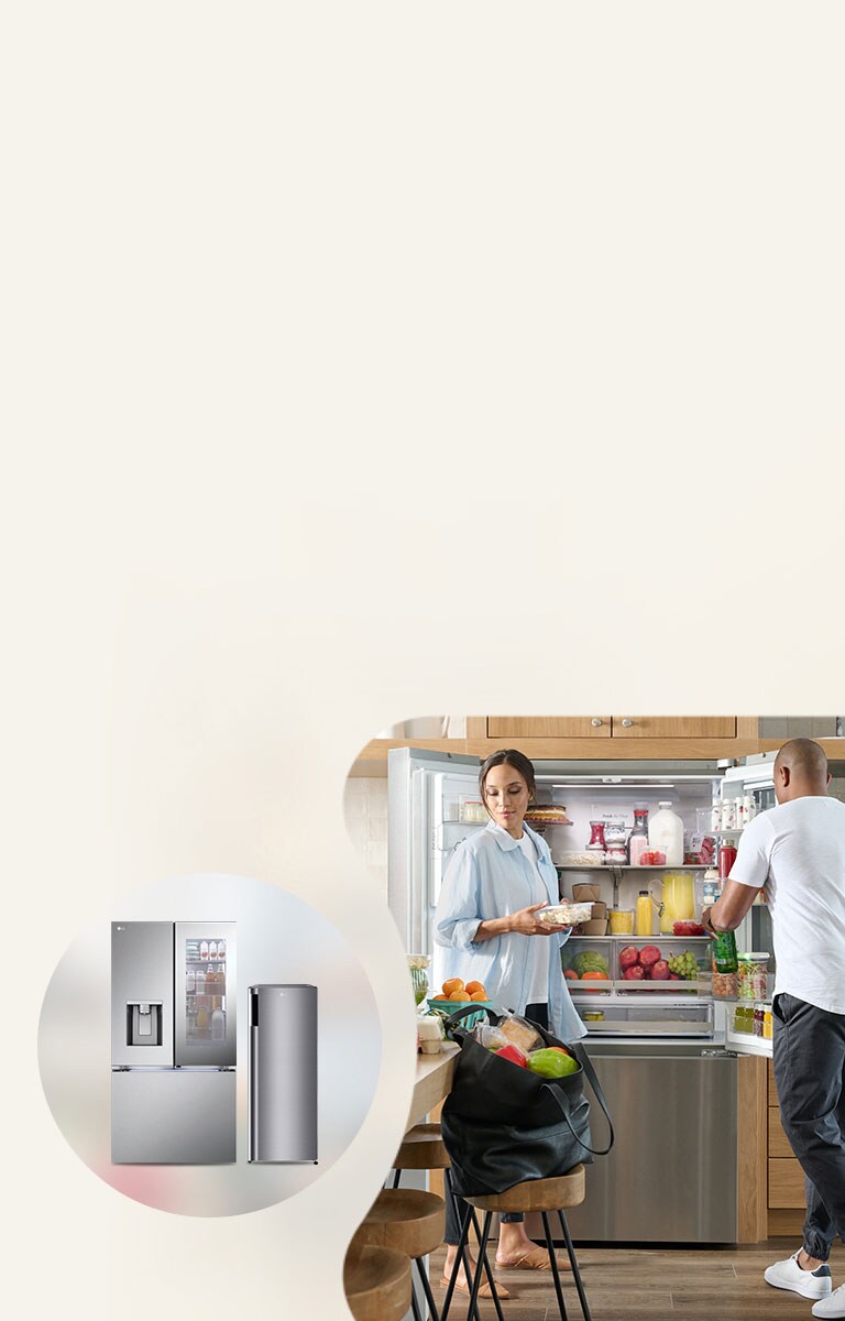 a couple packing food in front of a refrigerator