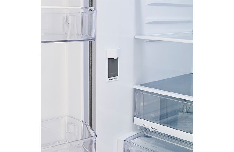 Refrigerator interior showcasing internal water dispenser