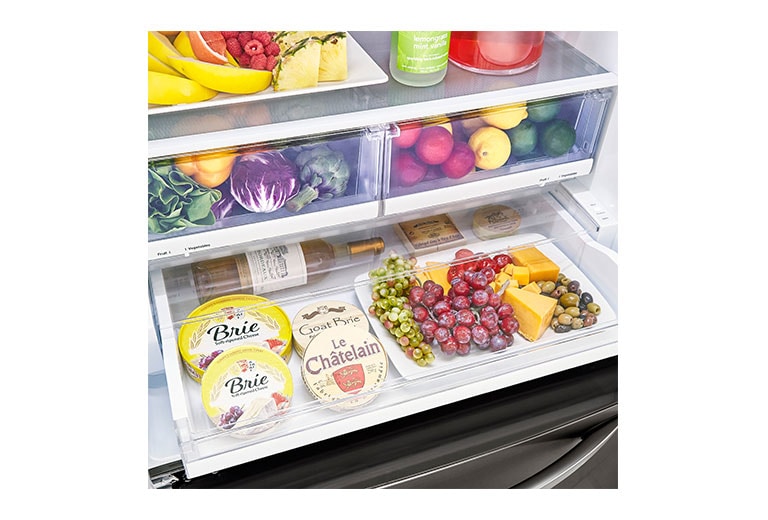 LG LRFXS2503D refrigerator showcasing filled temperature-controlled drawer