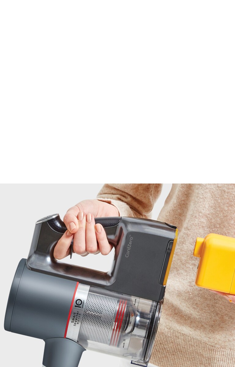 Battery being inserted into a vacuum