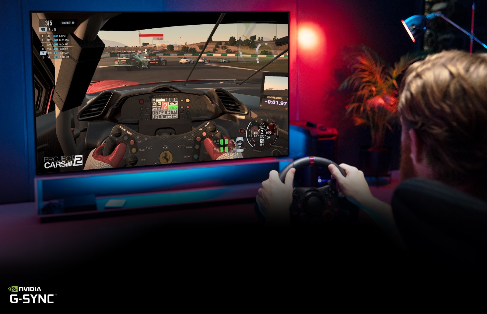 Man sitting on a racer gaming chair, holding a racing wheel while playing a racing game on a TV screen