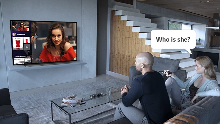 Woman asking TV, "Who is she?" to find out who the actress is