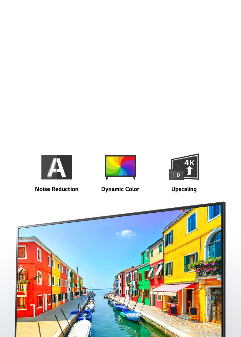 A LG NanoCell TV screen displaying a port city where buildings are painted in multiple colors and little boats are anchored in long and narrow harbor to highlight the Quad Core Processor 4K on LG TVs