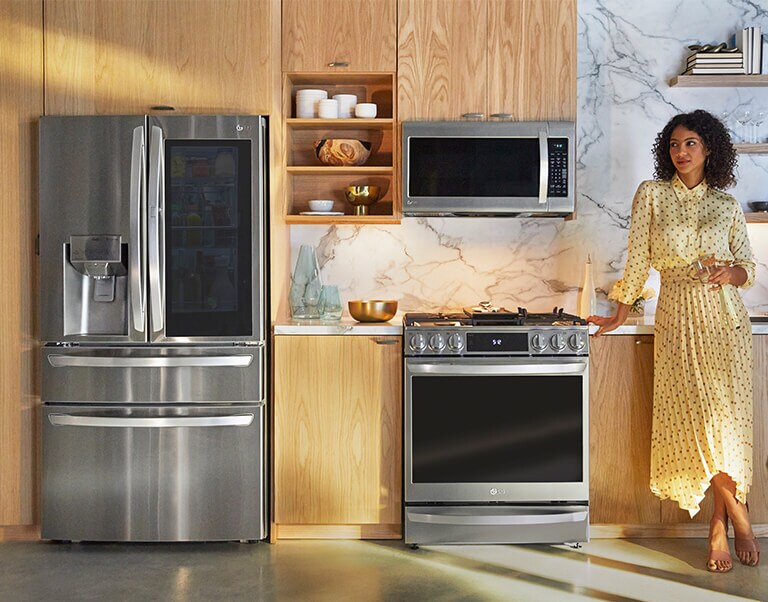 Woman standing in kitchen thumbnail for mobile