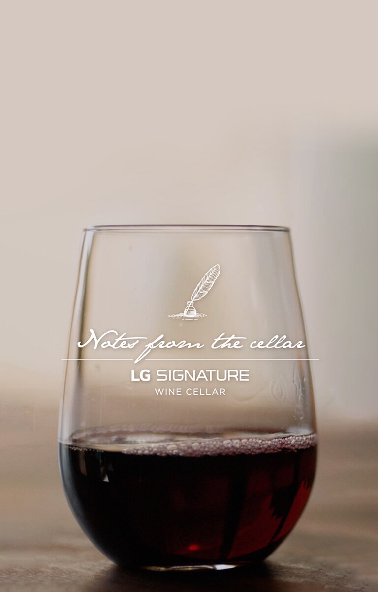 A cup of red wine is placed on the table.