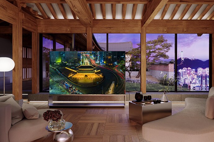 LG SIGNATURE OLED 8K is placed in the living room of Hanok, Korean traditional house, with a city backdrop of Seoul.