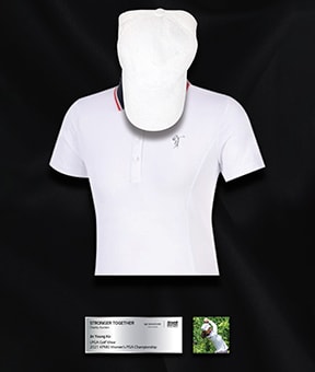 A gold shirt and cap set in a black display case with a small silver plaque underneath.