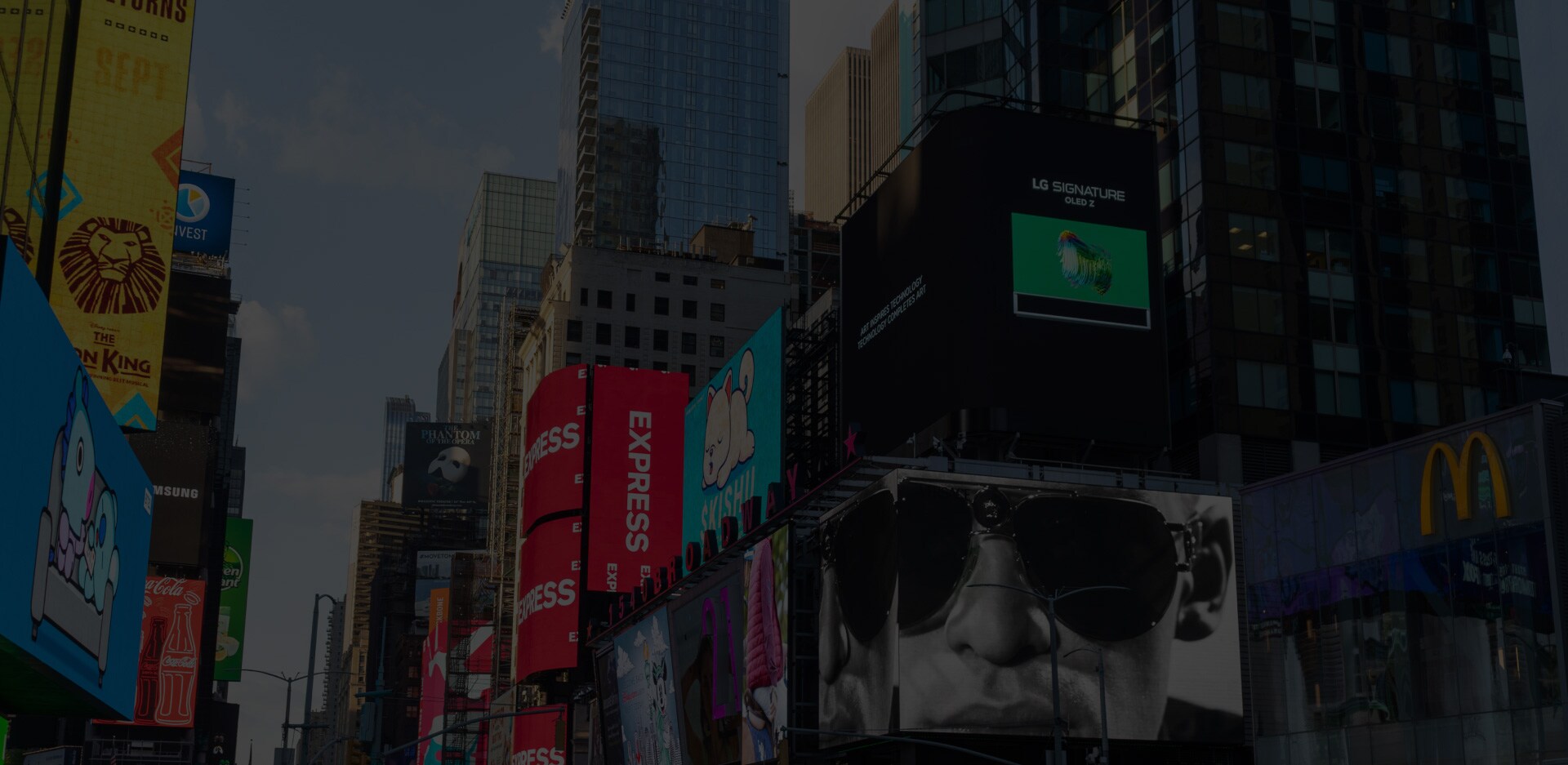 LG SIGNATURE advertisement picture displayed on a billboard on Times Square street.