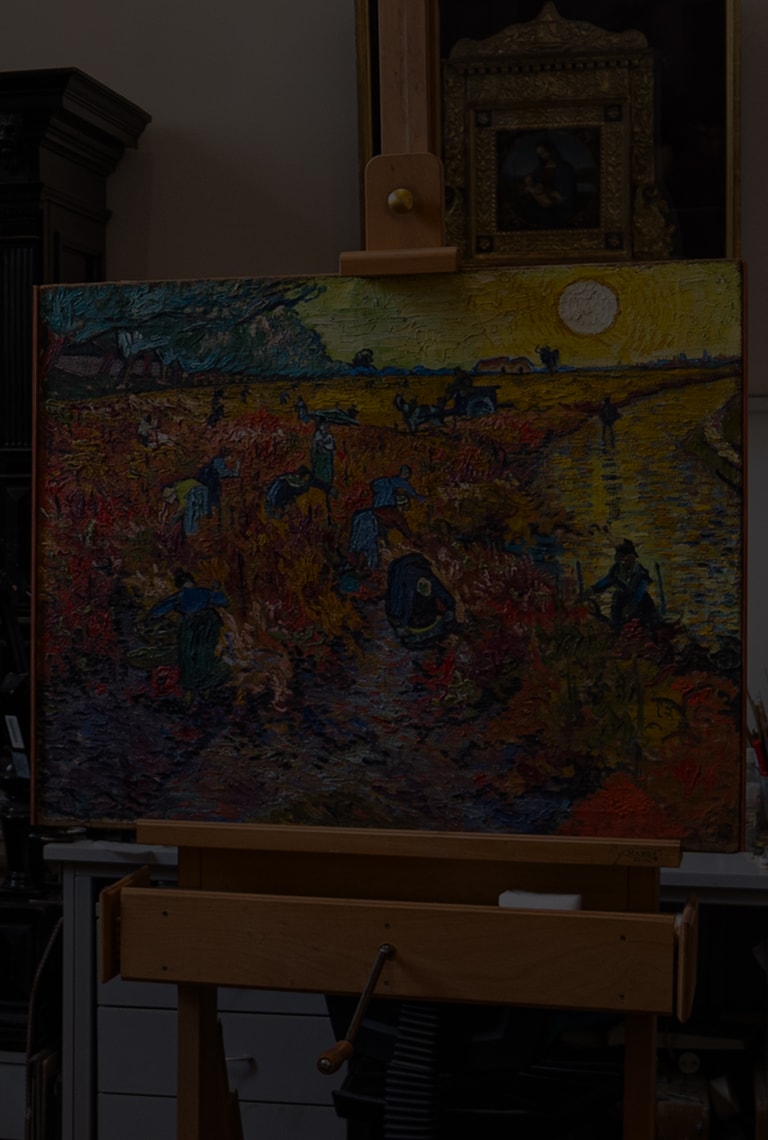 An image of The Red Vineyards at Arles on an easel.