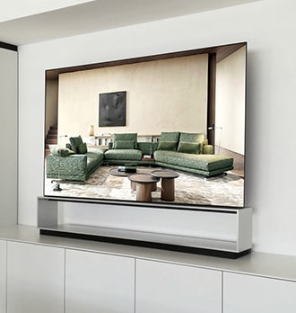 A spacious living room with green couches is displayed on the screen of LG SIGNATURE OLED 8K.