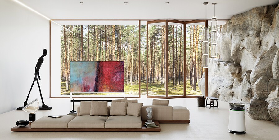 LG SIGNATURE OLED 8K TV is placed on the natural living room in harmony with B&B Italia’s dock sofa system.