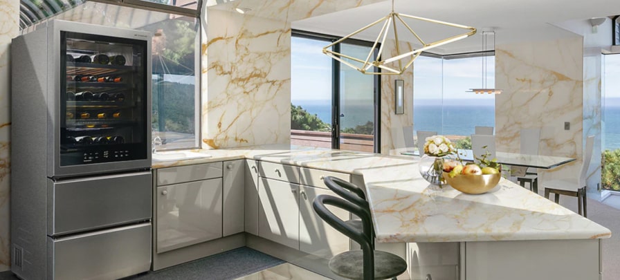 LG SIGNATURE Bottom Freezer fits right in in an airy, bright marble kitchen