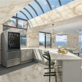 LG SIGNATURE Bottom Freezer fits right in in an airy, bright marble kitchen