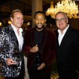 Jean-Charles Boisset, John Legend, and James Suckling pose together for a photo.