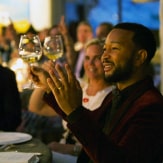 John Legend sits in the audience and makes a gesture in reaction to Jean-Charles Boisset's performance.