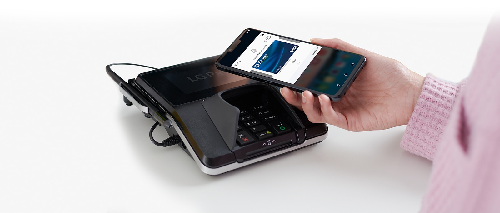 Image of someone using LG Pay.