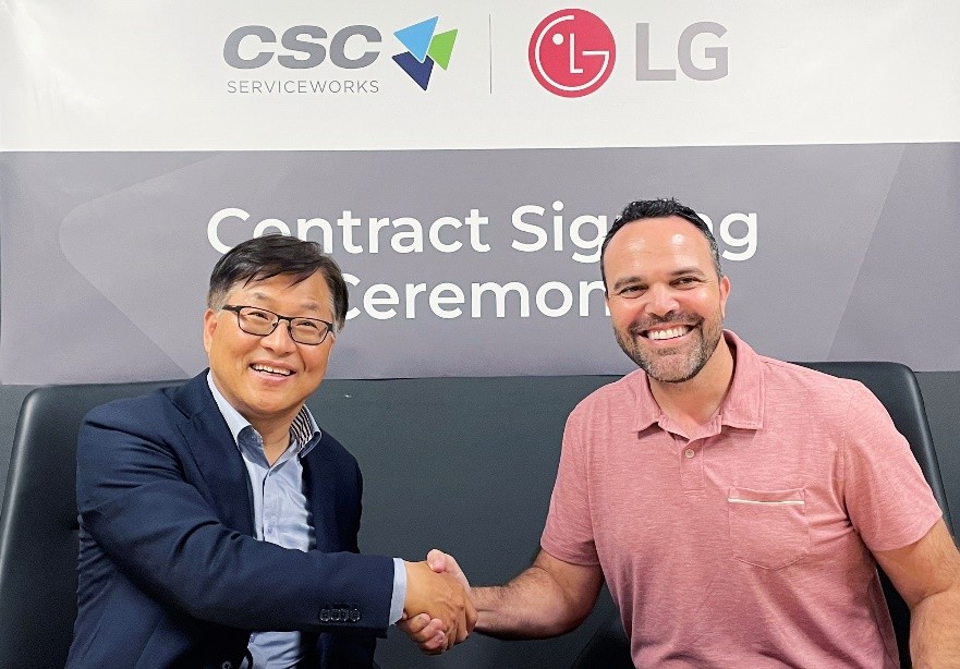 LG Electronics USA and CSC ServiceWorks representatives shake hands