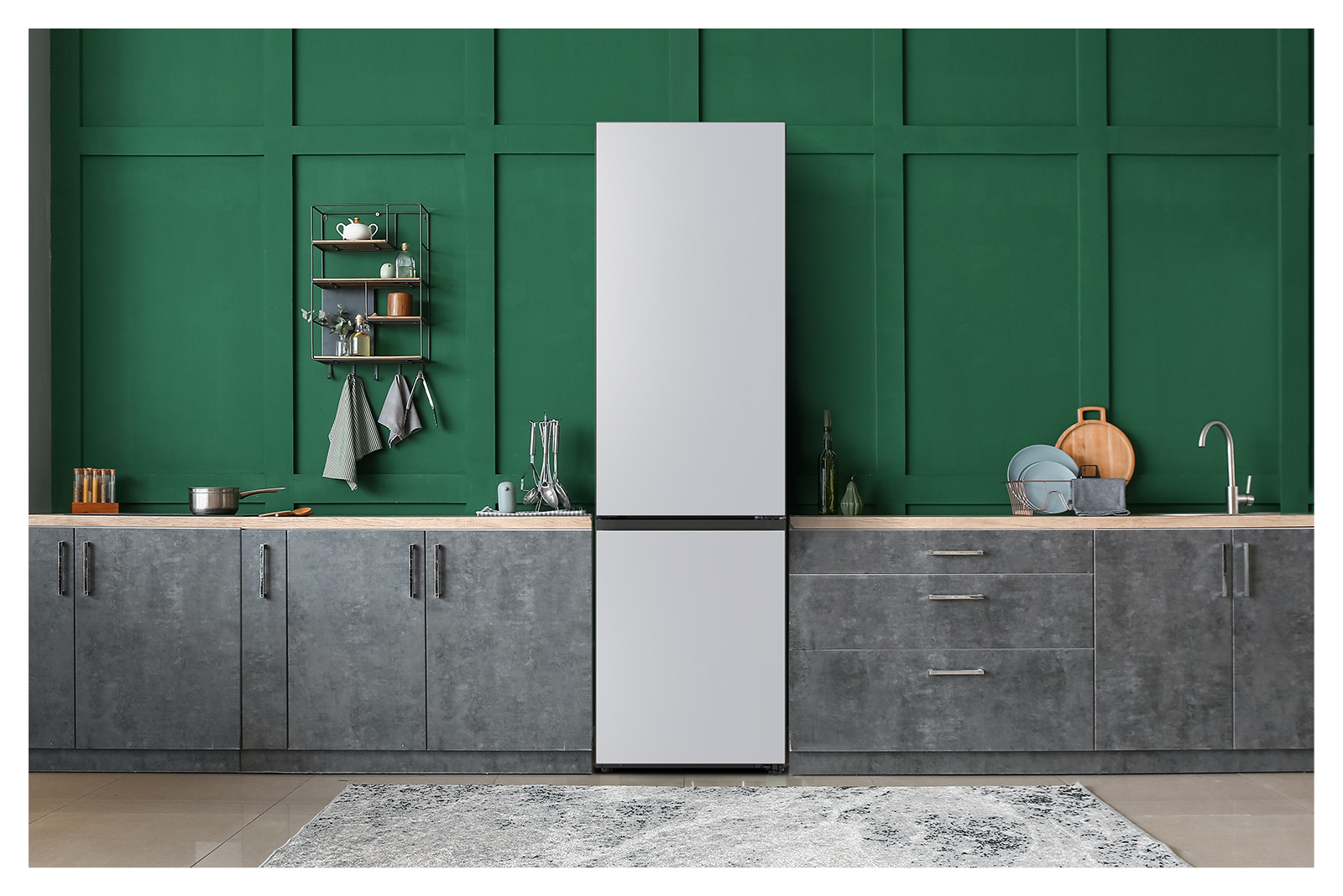 It shows mist silver color Bottom Freezer placed in the kitchen 