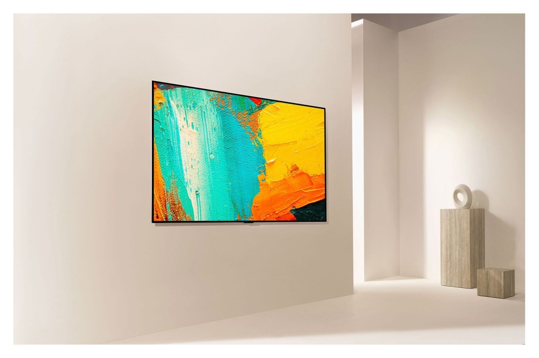 LG Smart OLED GX | GX 65'' | 4K | ThinQ AI | a9 Gen4 , Sanʼat asari singari devordan nafosat bilan chiqib turgan LG Gallery Design televizorining yon tomondan koʻrinishi, OLED65GXRLA, thumbnail 9
